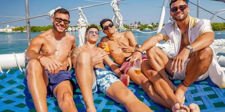 Friends having fun in catamaran party