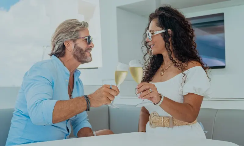 Sharing a drink in luxury catamaran